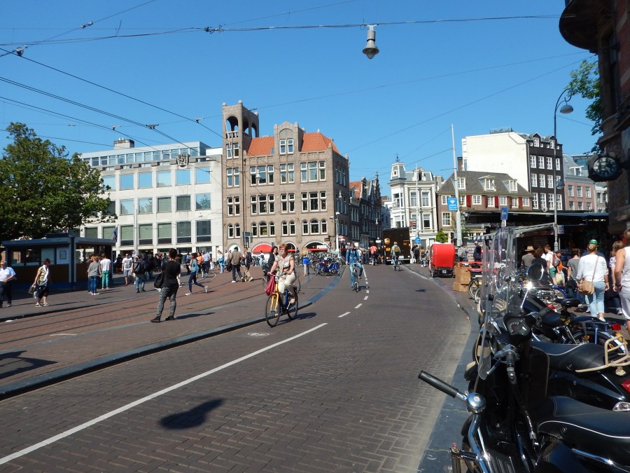 you can see the trolley tracks and scooters parked on the right